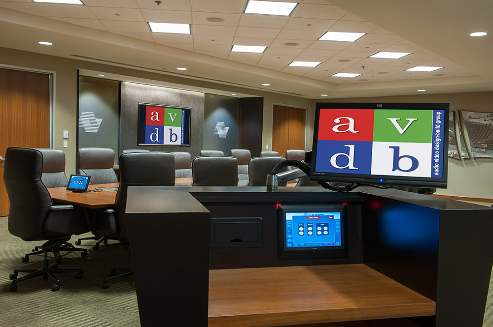 Multiple AV control options are located throughout the room, including from portable devices such as an iPad.