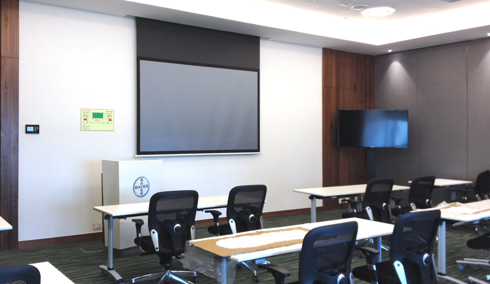 A single XTP CrossPoint 1600 provides AV and control signal switching and distribution within the four-way divisible boardroom and training space.