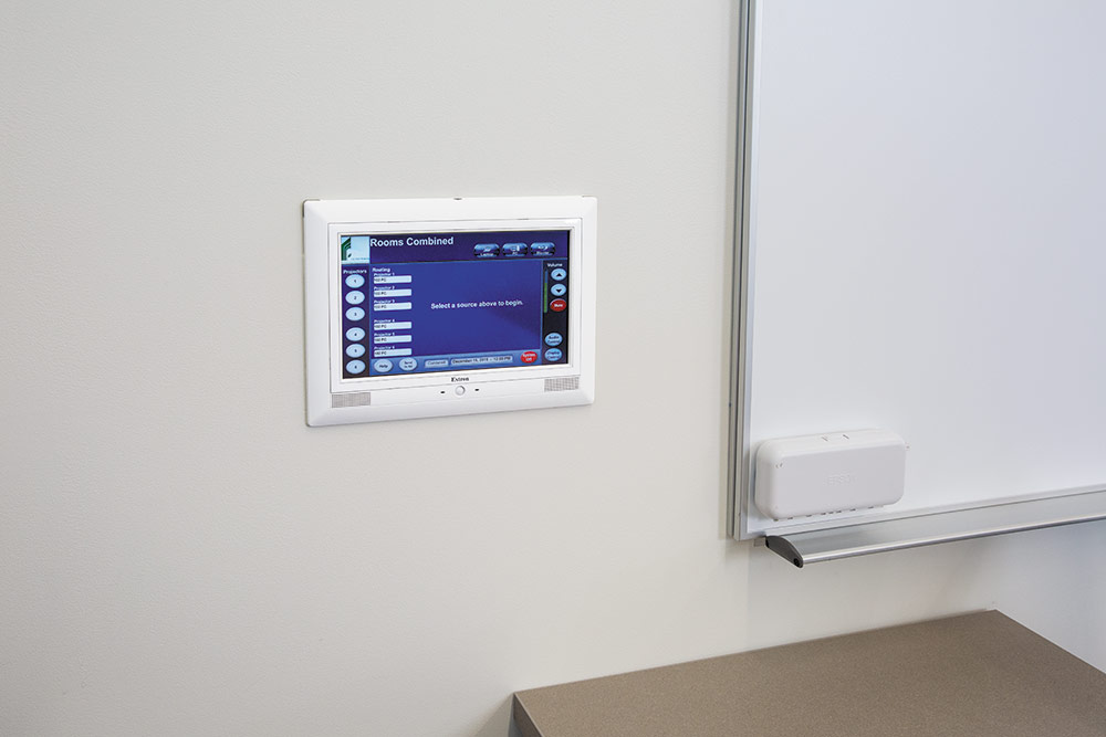 TLP Pro 1020M 10” TouchLink Pro touchpanel mounted on the wall