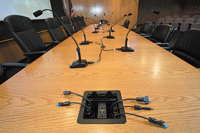 Cable Cubby 600 enclosures installed in the lectern and at both ends of the head table offer HDMI, VGA, Audio, and LAN connectivity plus power for portable devices.
