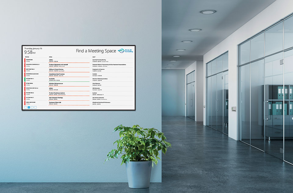 Extron Room Scheduling panel placed on an office wall.