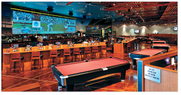 Up to 12 different sports programs can be displayed simultaneously on three,
                        frameless screens than span nearly 37 feet in the stadium-themed sports bar.