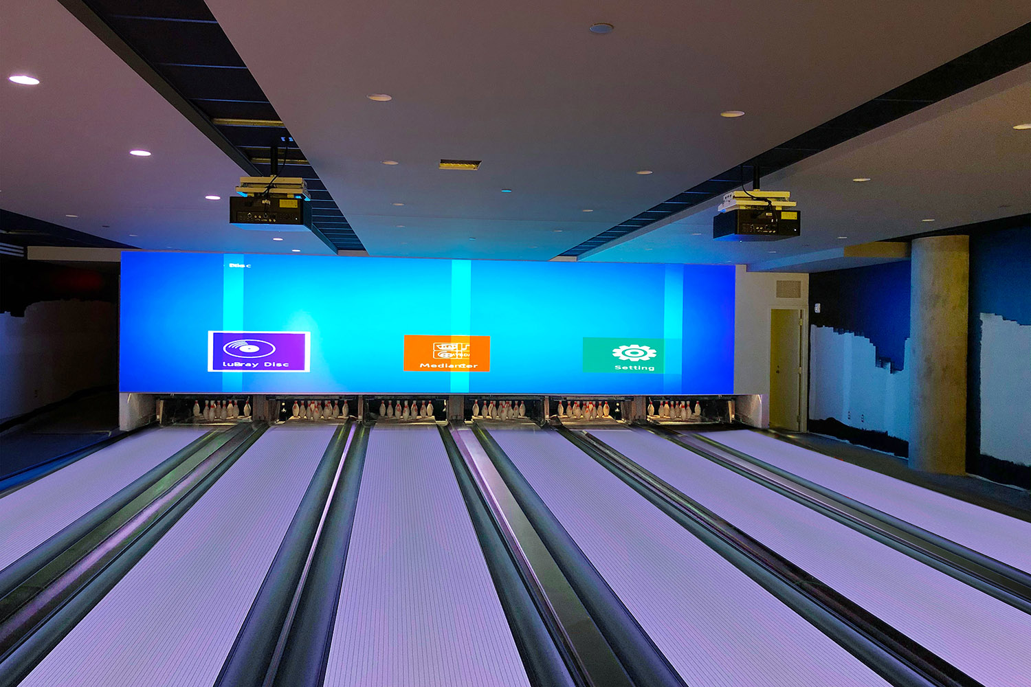 The videowall system enables the first-floor bowlers and the bar patrons to watch sporting events and other content on any portion of the videowall. Those in the second-floor bowling alley can have an identical or unique viewing experience.