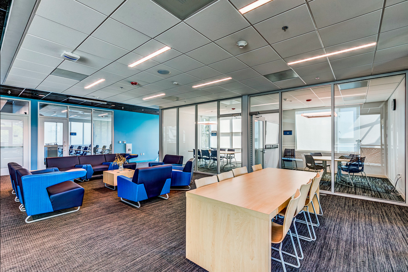 Student lounges include working surfaces for ad-hoc meeting and collaboration outside of designated learning spaces.