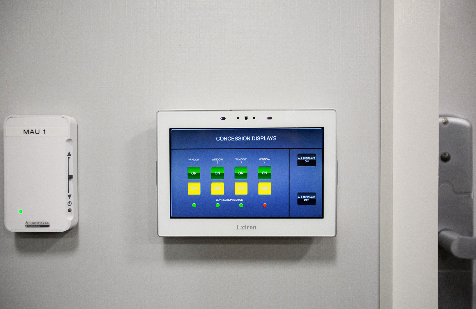 Authorized users are able to update or replace menu content on the fly using Extron GUI Designer along with Global Configurator Professional on a TouchLink Pro touchpanel mounted on a workspace wall.