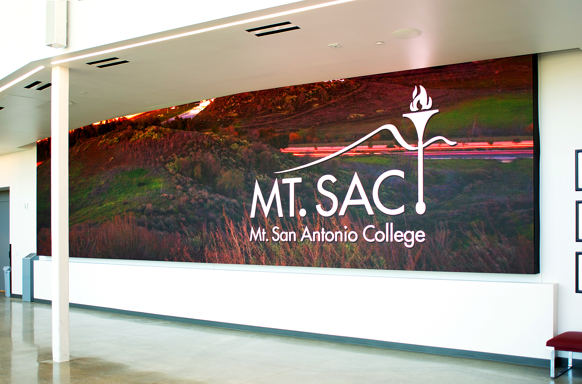 The videowall in the hallway leading to the main gym highlights current game stats, upcoming competitions and events, and campus news.