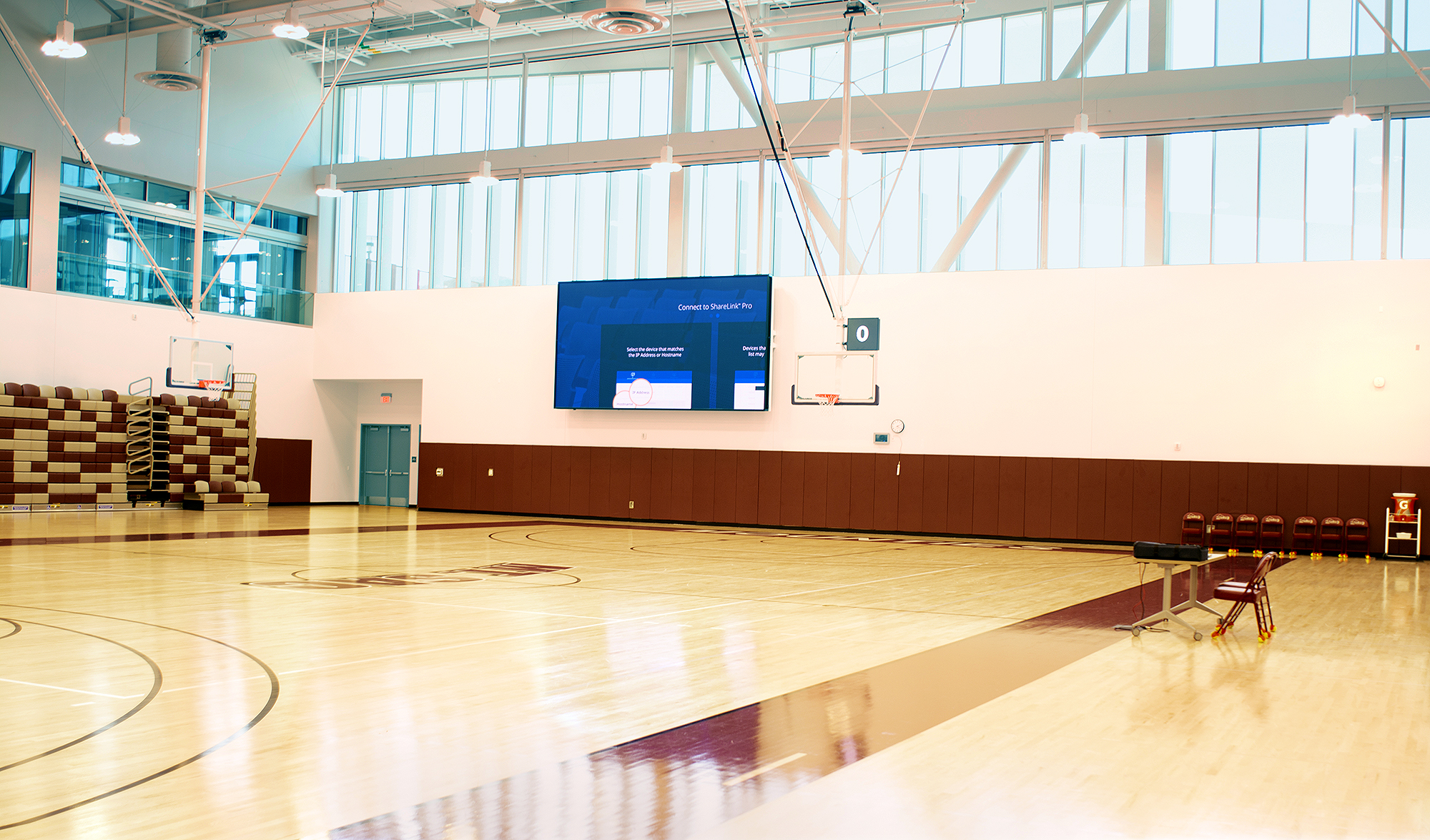 Throughout the complex, 13 videowalls receive content via the the Extron NAV Pro AV over IP system, including this scoreboard in the main gym.