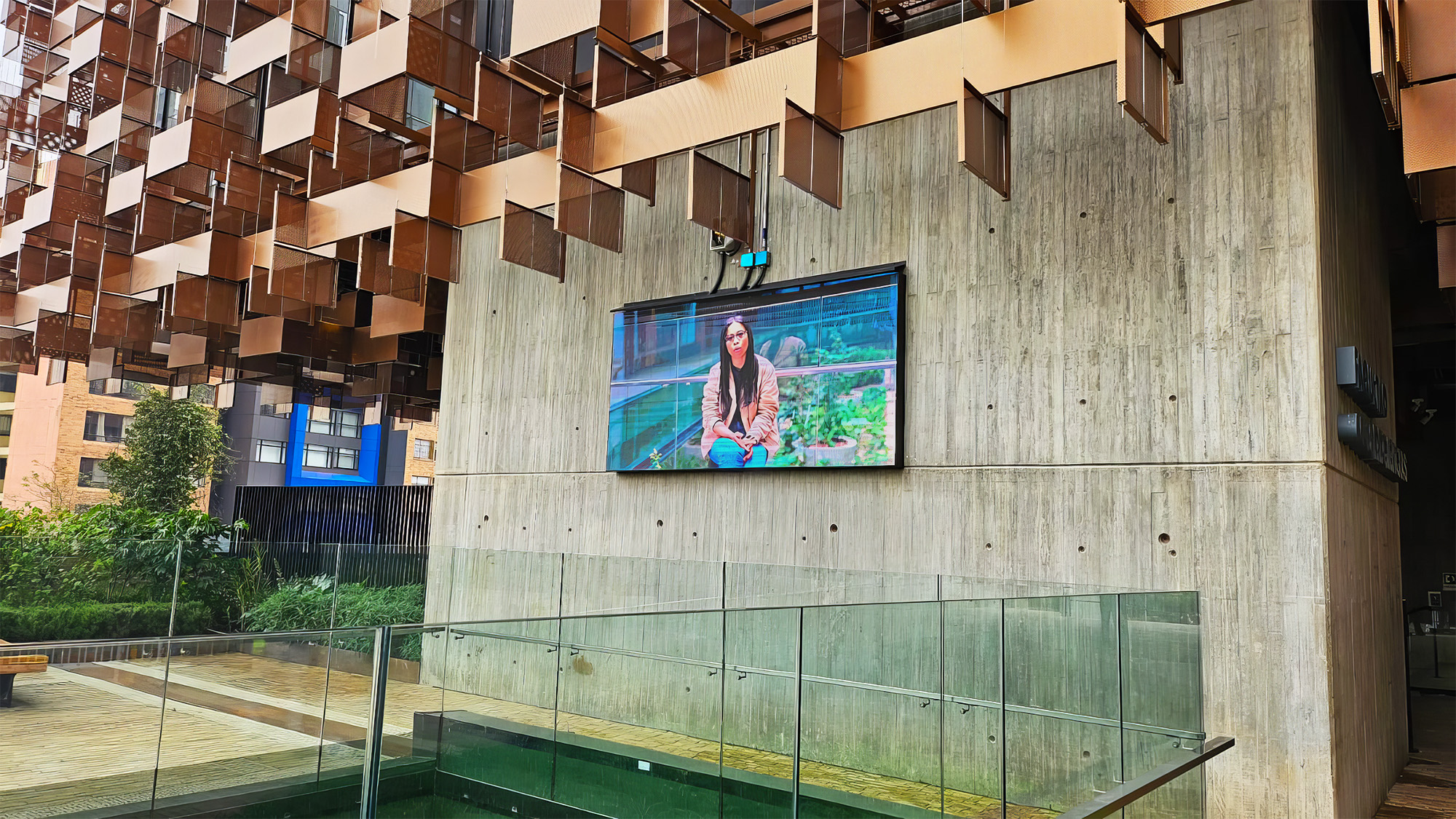 An Extron SMD 101 Streaming Media Decoder provides HDMI video to multiple digital signage displays, including this display in the Science Building entry courtyard. Digital signage content produced by a PC located in the Science Building cafeteria is delivered to the SMD 101 via the campus Ethernet LAN.