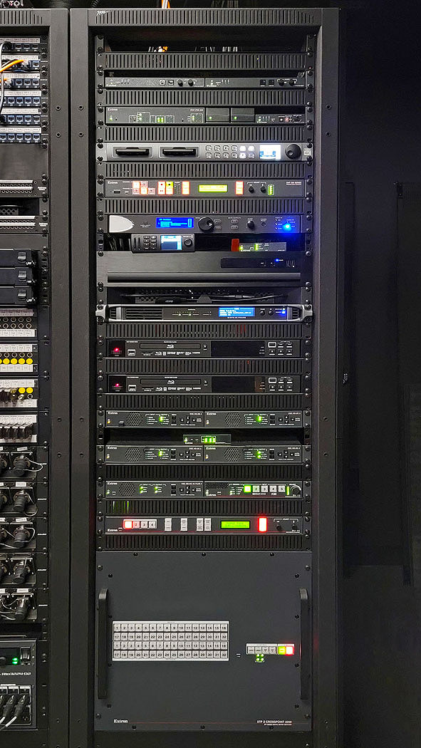 Because of the efficient size and multiple capabilities built into Extron AV products, system components occupy a minimal number of racks, fitting easily within the control center.