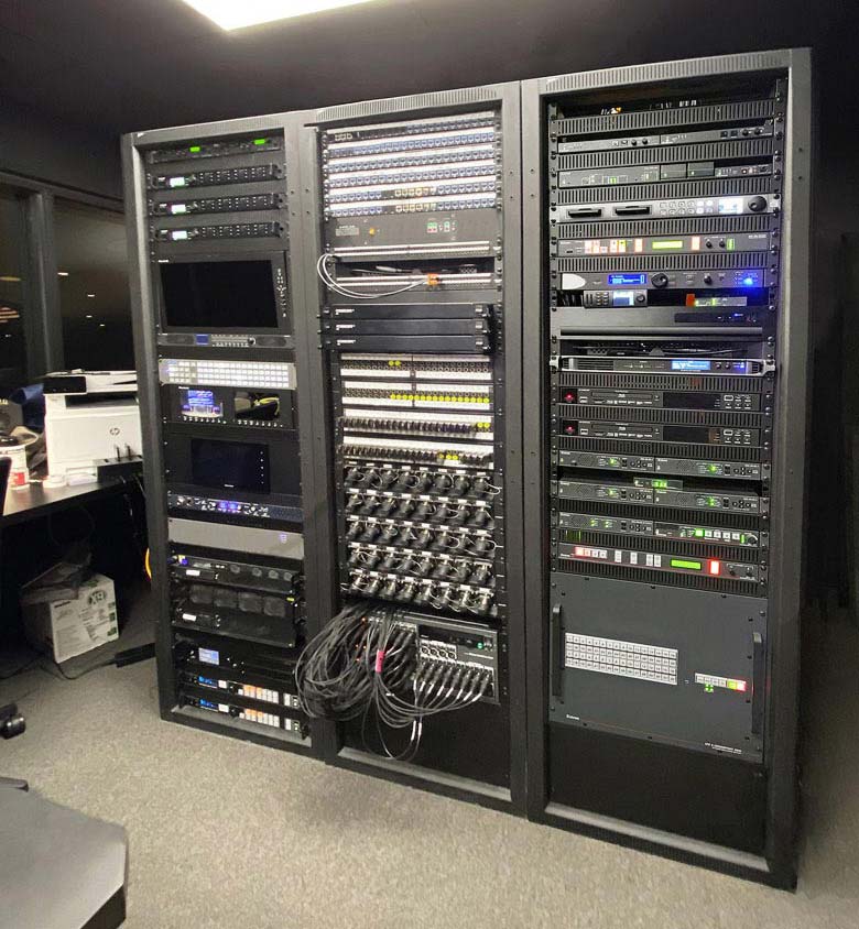 Thumbnail - The auditorium’s AV system components such as the Extron XTP II CrossPoint matrix switcher, the multi-window processor, and the dual-recording streaming media processor are conveniently rack-mounted within the control center.