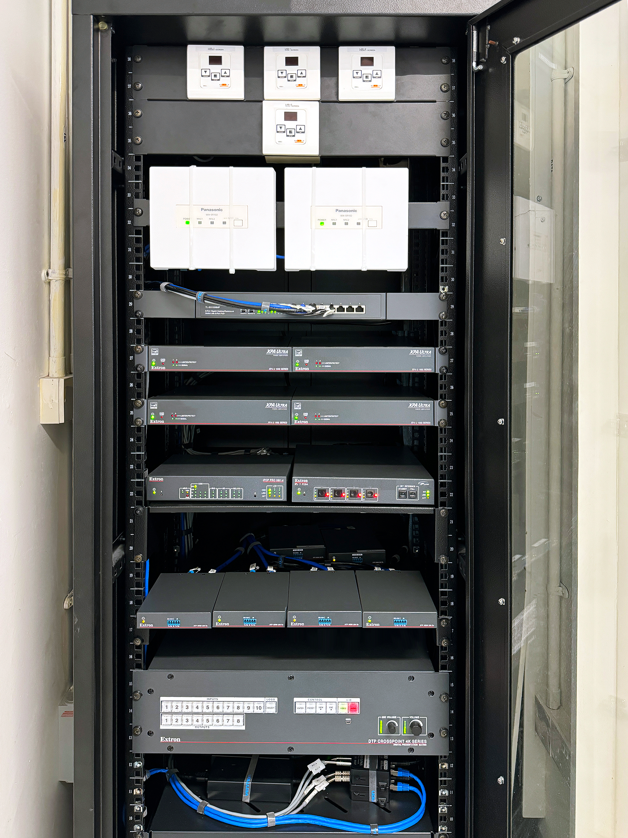 The Extron DTP CrossPoint 4K matrix switcher in this rack ensures smooth 4K video and audio distribution across SUTD’s Lecture Theaters, providing reliable AV routing for multiple sources and displays.