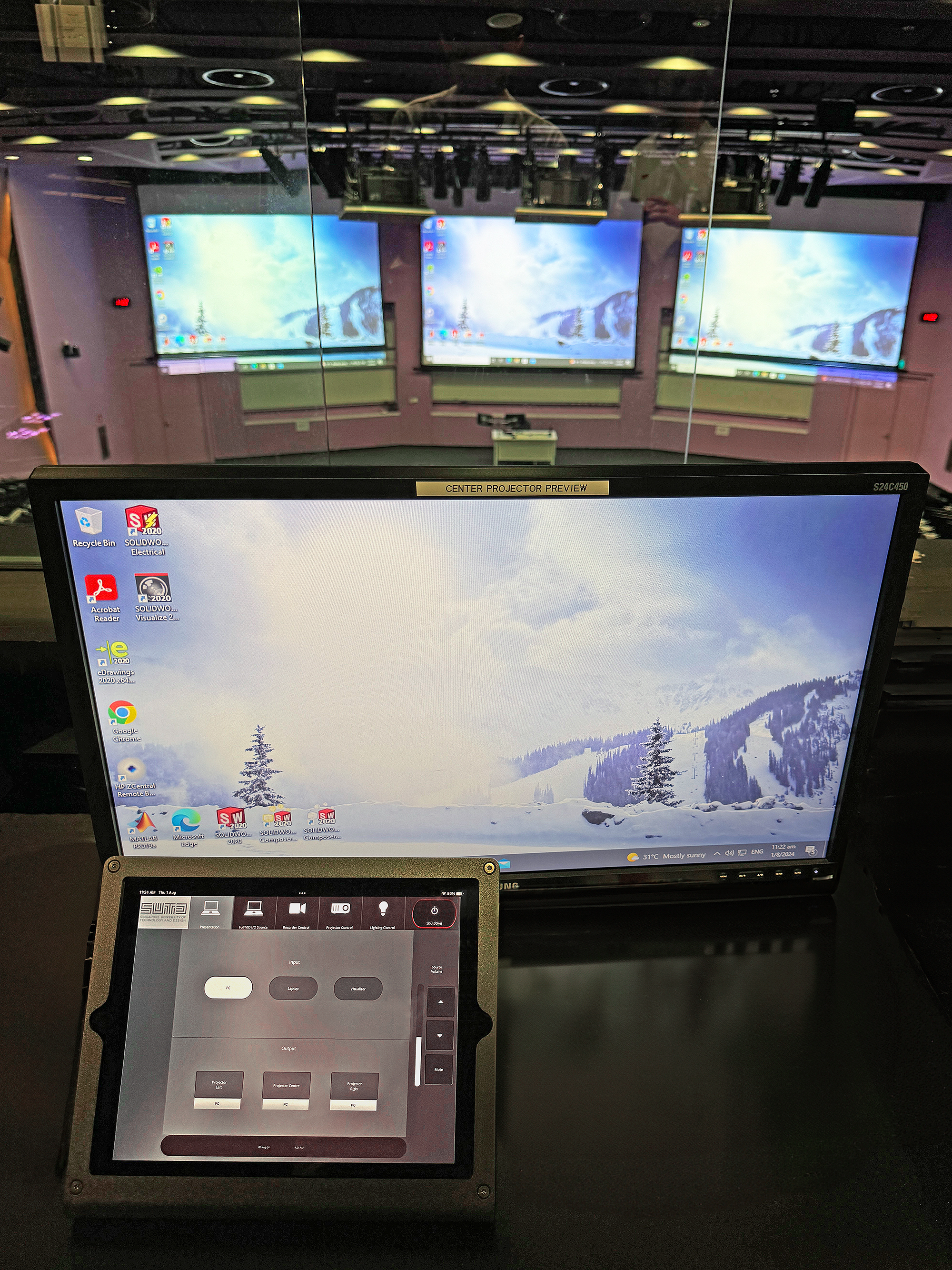 The control room in Lecture Theater 1, featuring Extron’s advanced control systems, provides a full view and management of AV operations for seamless event coordination at SUTD.