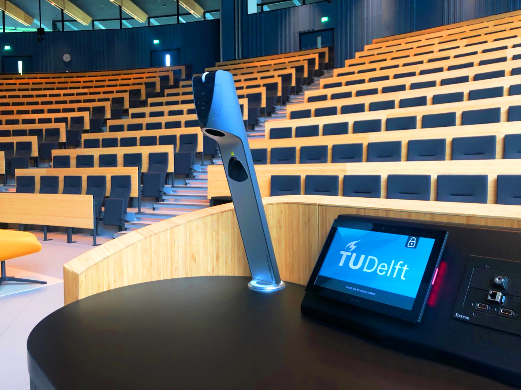 An Extron TouchLink Pro touchpanel makes it easy for instructors to select between various sources for display on the screens in the large lecture hall.