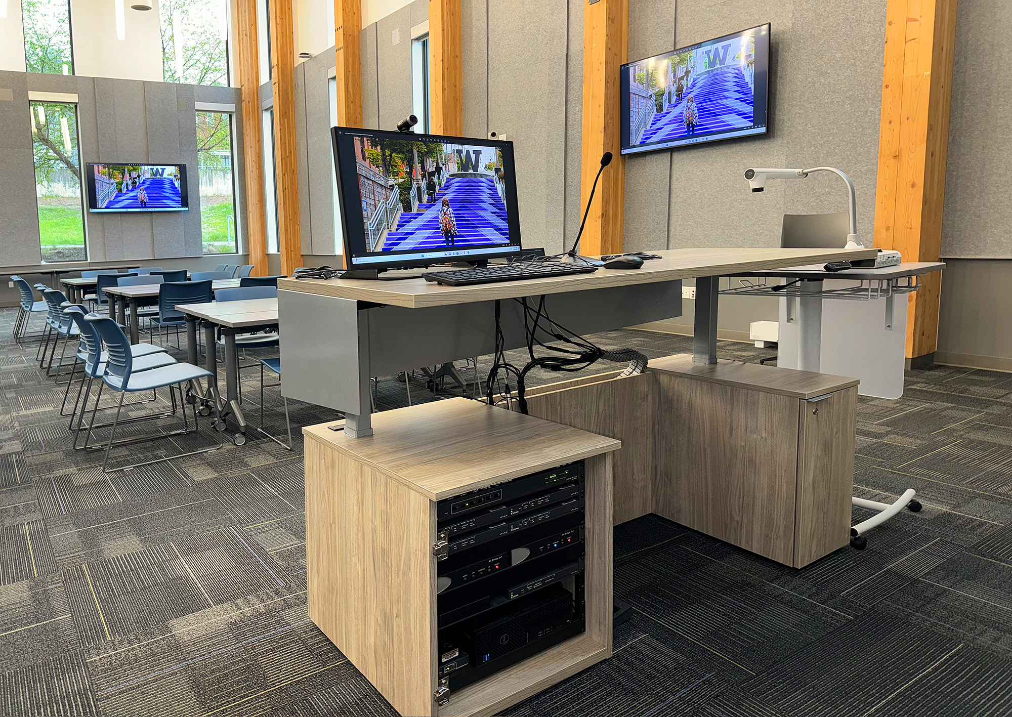 HIPs adjustable-height lectern with AV equipment bay housed in lower left cabinet enclosure.