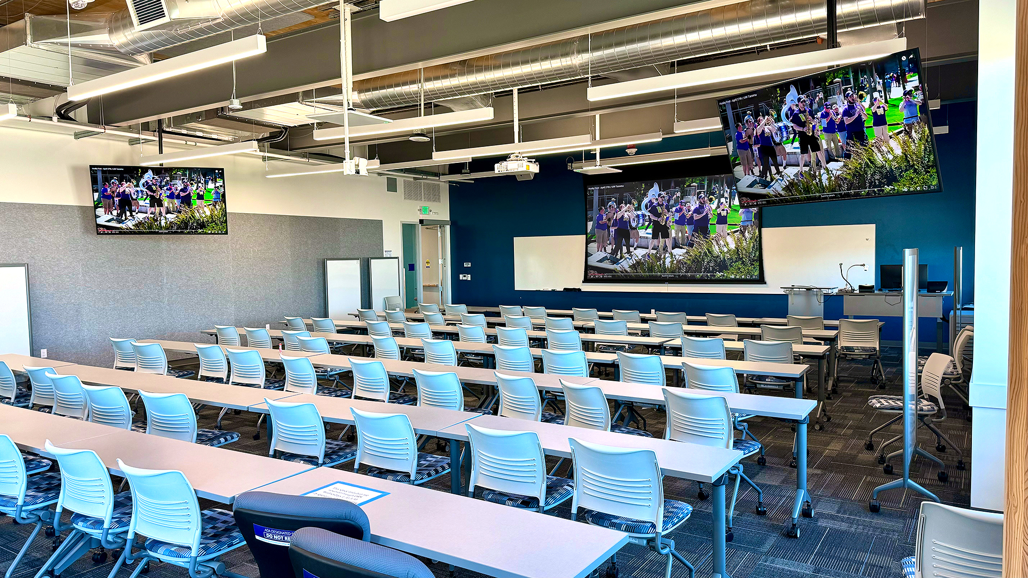 Classrooms 301 and 311 are each equipped with a projector and two flat panel displays.