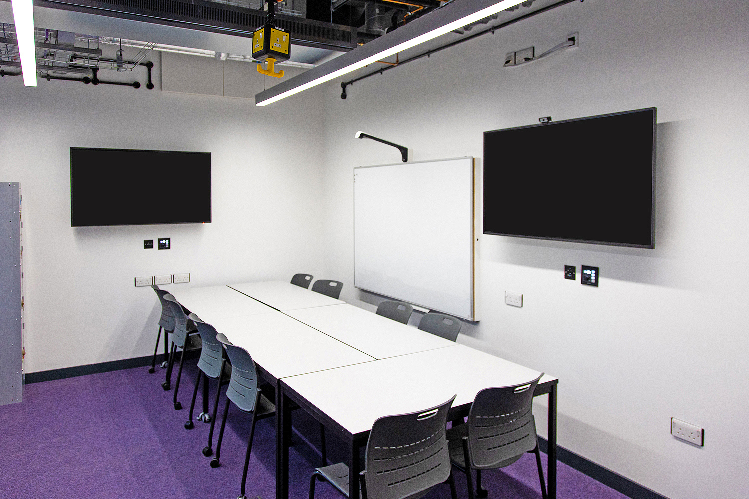 Thumbnail - Student spaces provide access to the same resources as classrooms. An Extron MediaLink controller and a network button panel enable source selection and local display control.