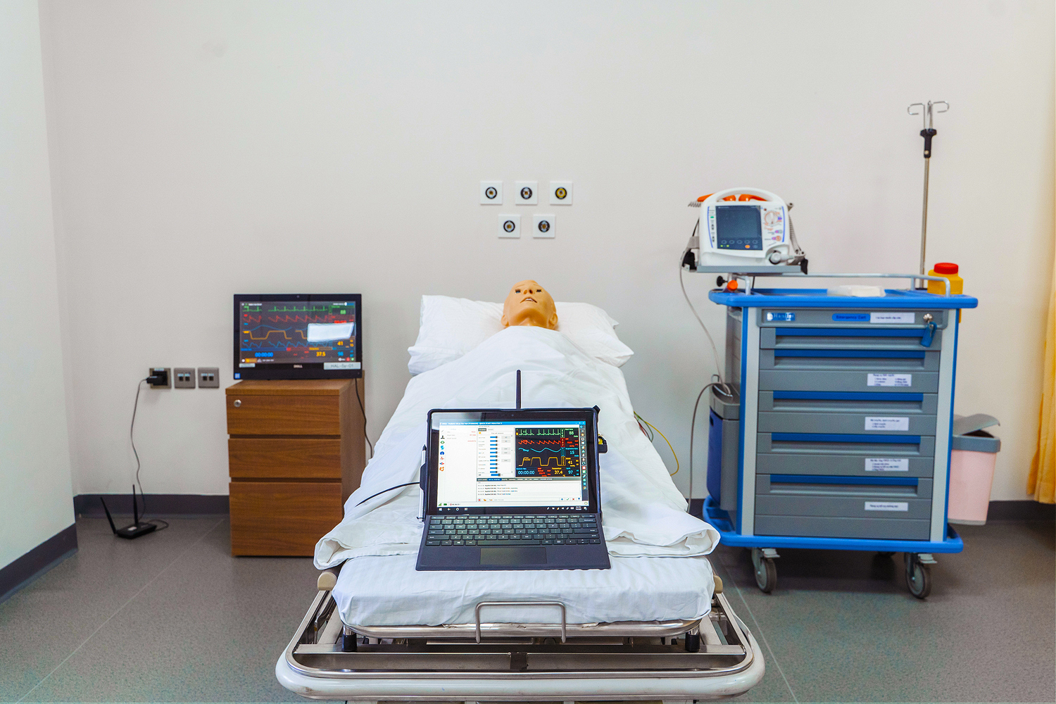 The standard operating procedure for controlling an interactive medical manikin is through a laptop or tablet.