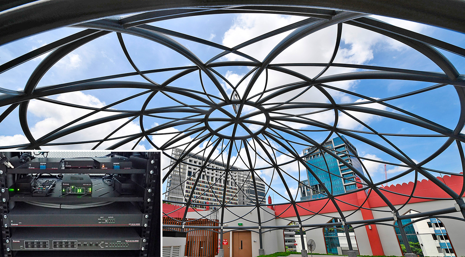Lattice dome of outdoor pavilion with inset image of matrix switcher and distribution amplifier