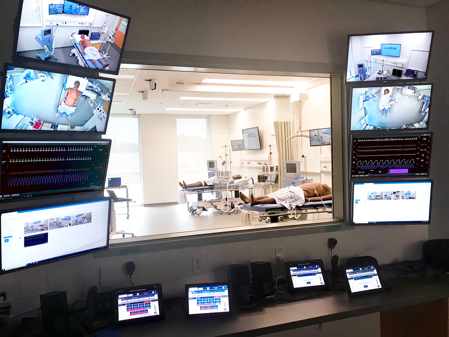 The patient simulator systems within rooms such as this High Fidelity Lab are tied to the AV system to allow two-way communication between the lab and the control room. 