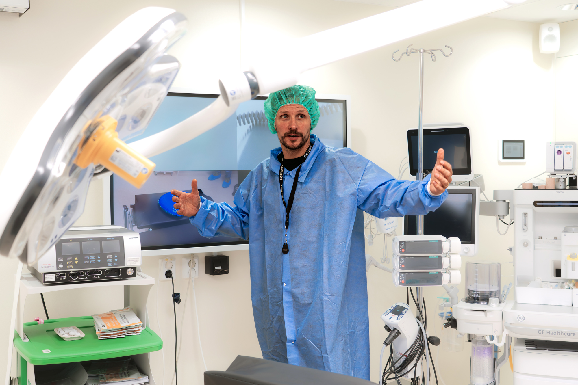 Martin Marten, CTO at Meetech stands in one of the center’s operating rooms where surgeons interact with the system using a 55-inch touch display in the operating room, connected via USB over the NAV System, which allows direct annotation on live video.