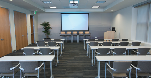 The large presentation room is fully-equipped with Extron products from floor to ceiling. Closets on the left provide ample storage as well as the AV rack.