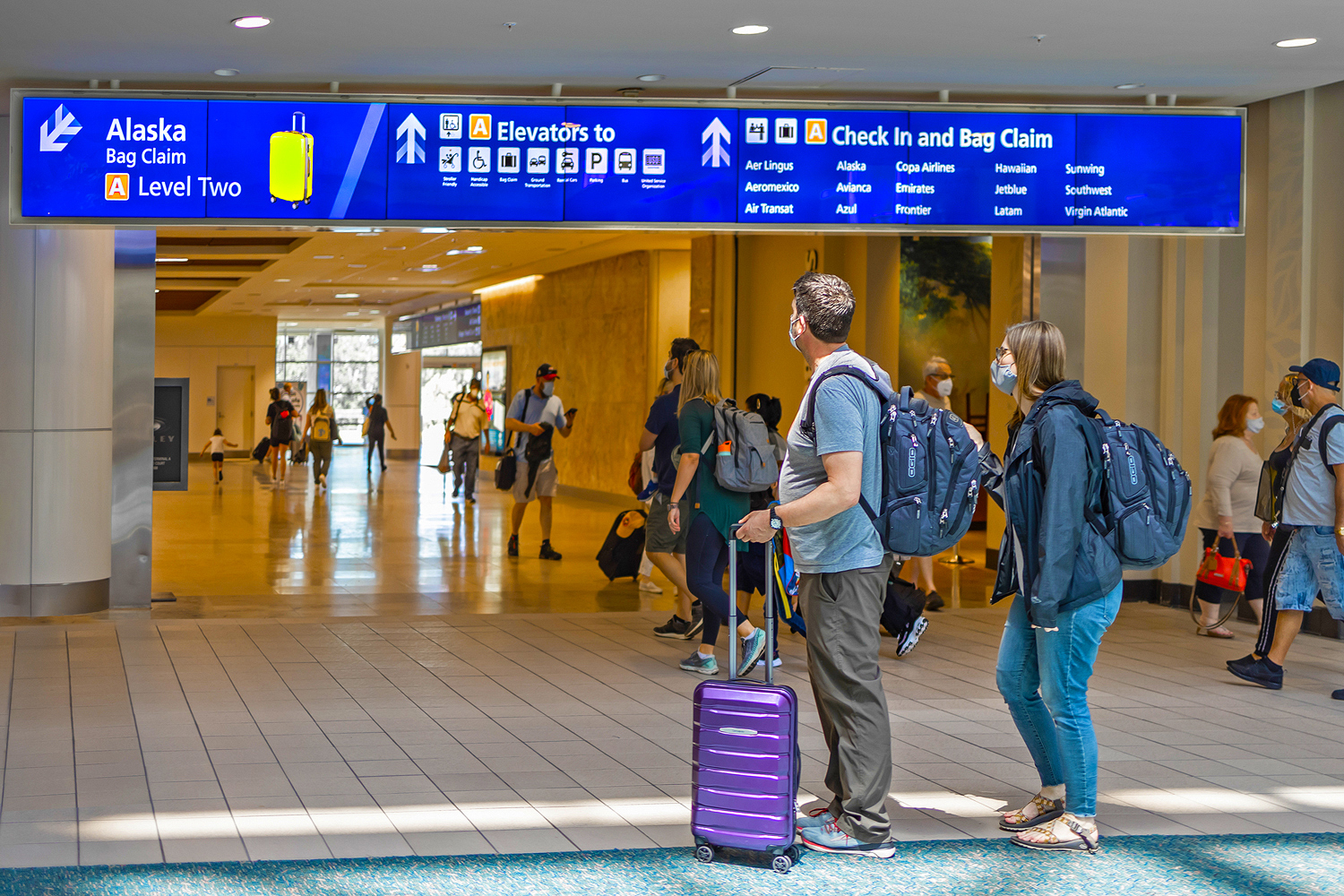 Large display systems in various configurations provide improved wayfinding, as well as engage and entertain waiting passengers.
