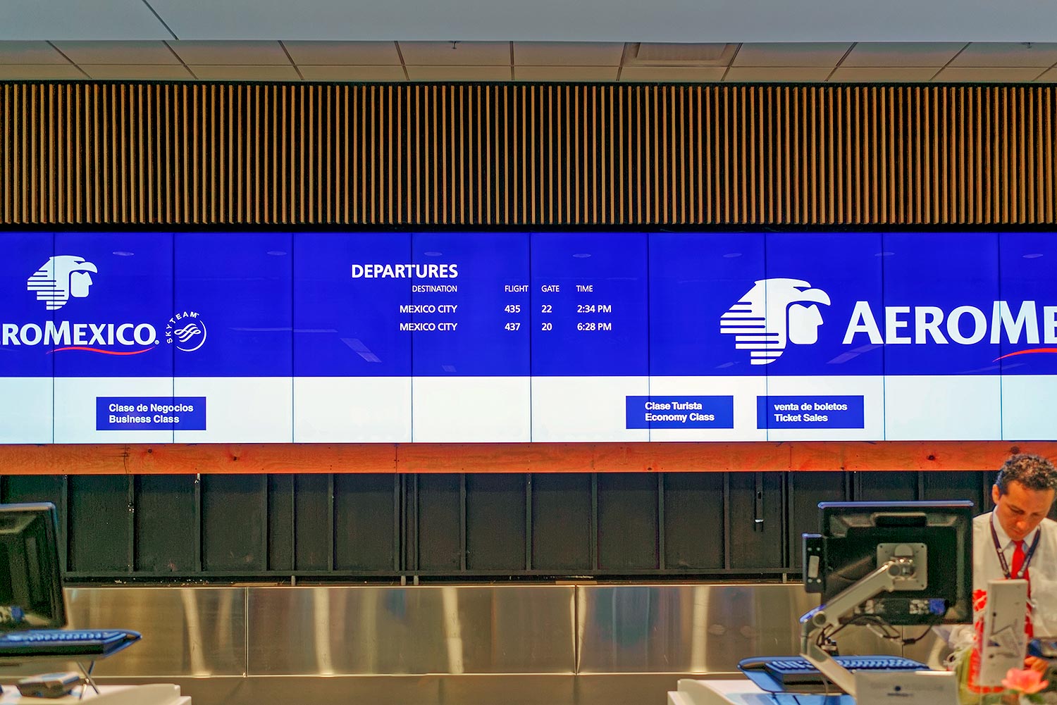 The continuous videowall above the ticketing area provides a constant flow of information to queueing passengers.