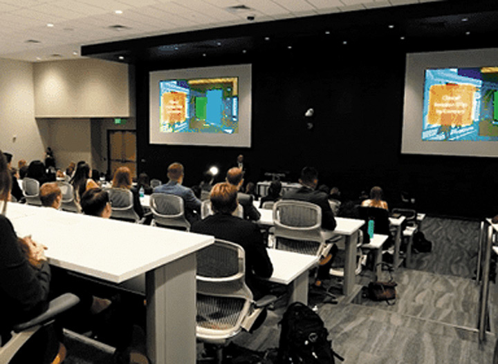 In each lecture hall, a DTP CrossPoint 84 4K matrix switcher routes signals to the two projection systems, as well as to the 90" confidence monitor at the back of the room and the Planar touch screen at the instructor station.