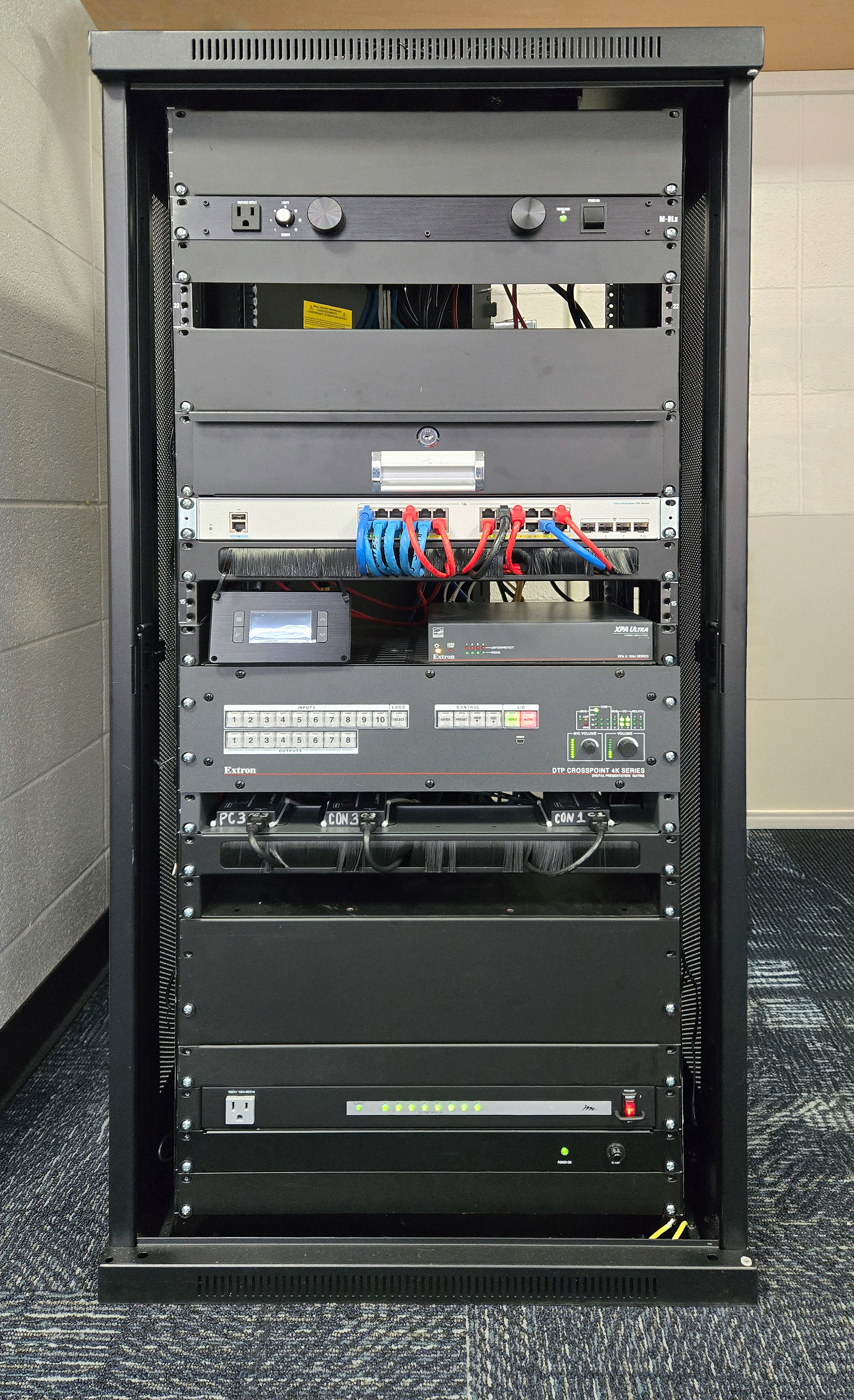 The backbone of ISU’s Esports Lab: an Extron-powered AV rack featuring the DTP CrossPoint 108 4K matrix switcher, audio DSP, and control systems for seamless video routing and low-latency performance.