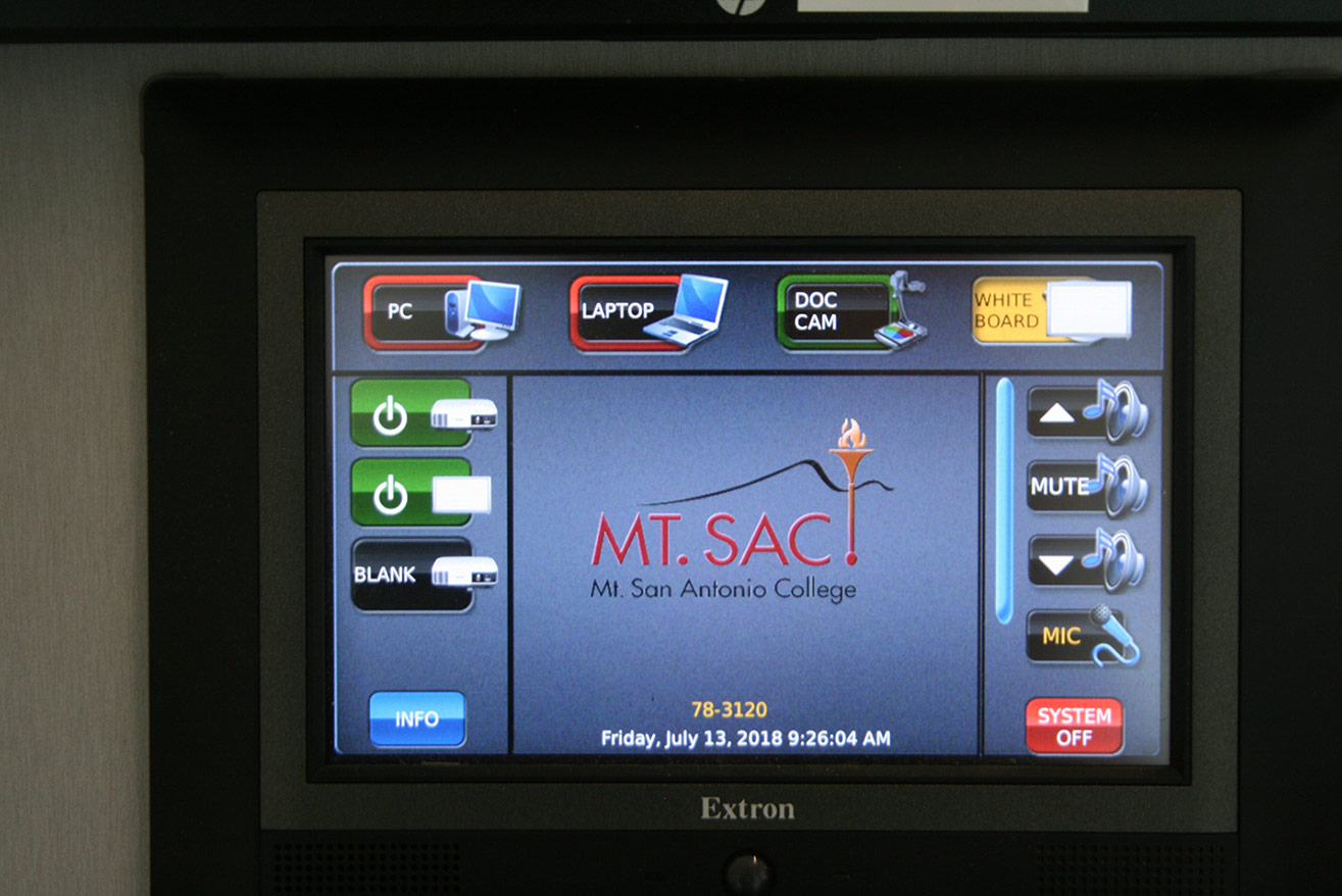 A control interface mounted on a wall of a BCT room