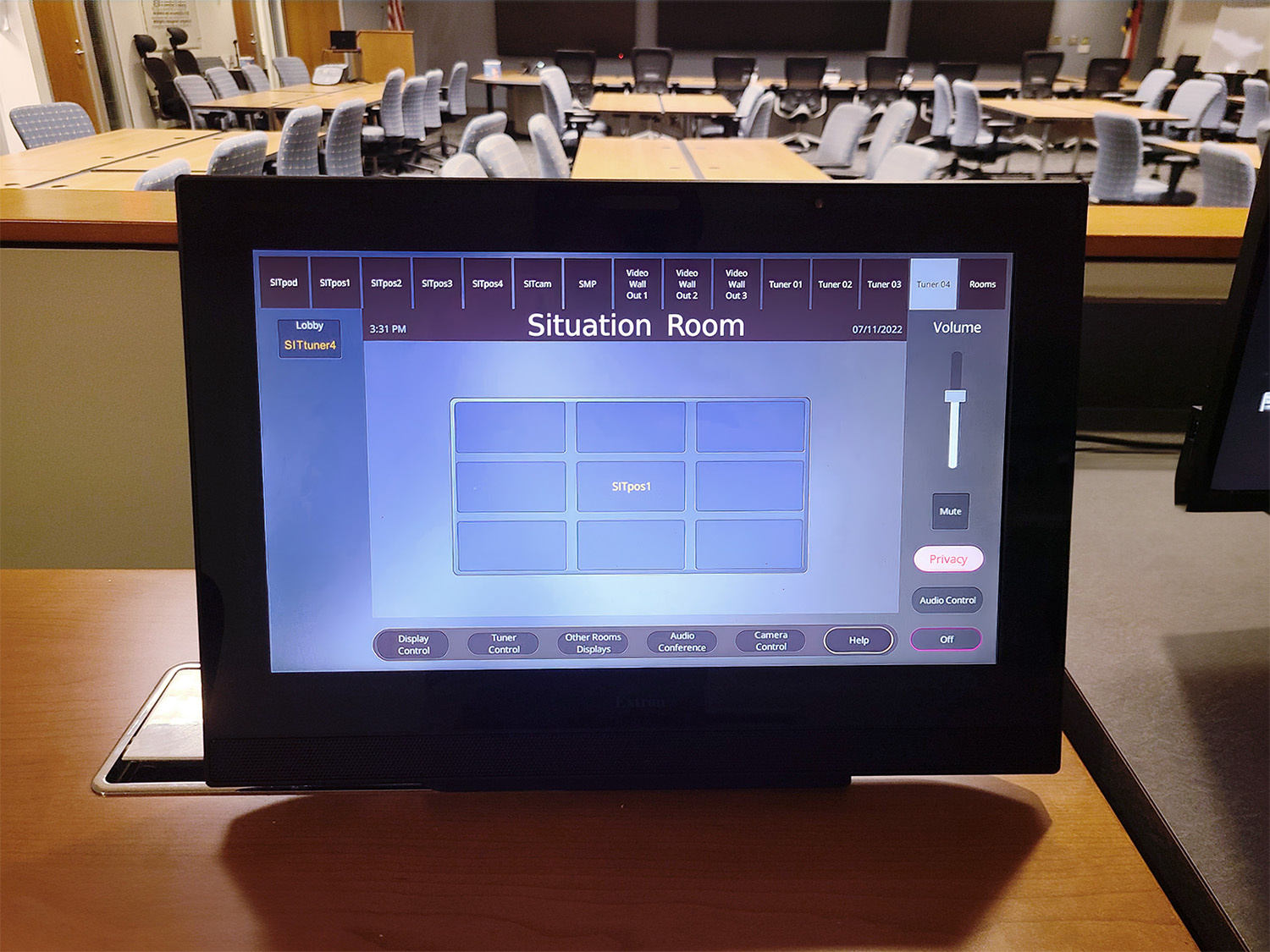 Thumbnail - AV signals from sources such as computers running specialized software, broadcast news feeds, and devices connected at the tables are sent to one or more of the displays, with all operations controlled by an Extron 15" tabletop TouchLink Pro touchpanel at the head table.