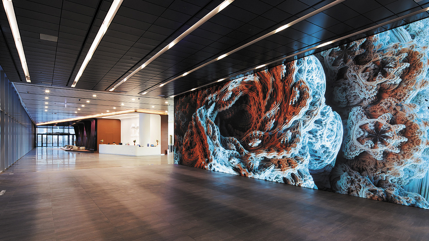 A digital signage covering one wall of the headquarters
