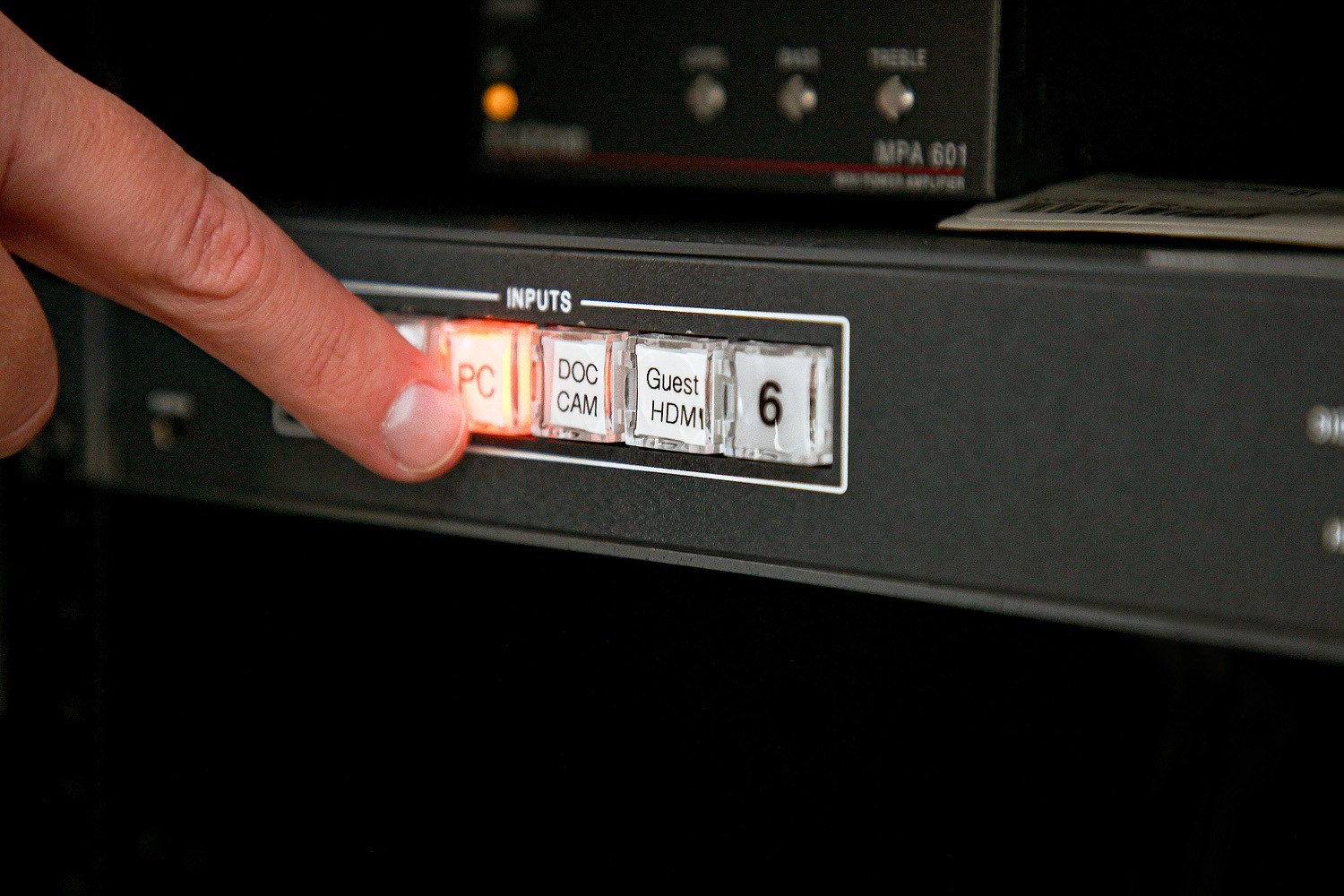 The switcher's clearly labeled buttons that light when pressed make AV source selection easy. Buttons 1 and 6 are spare inputs that allow future expansion.