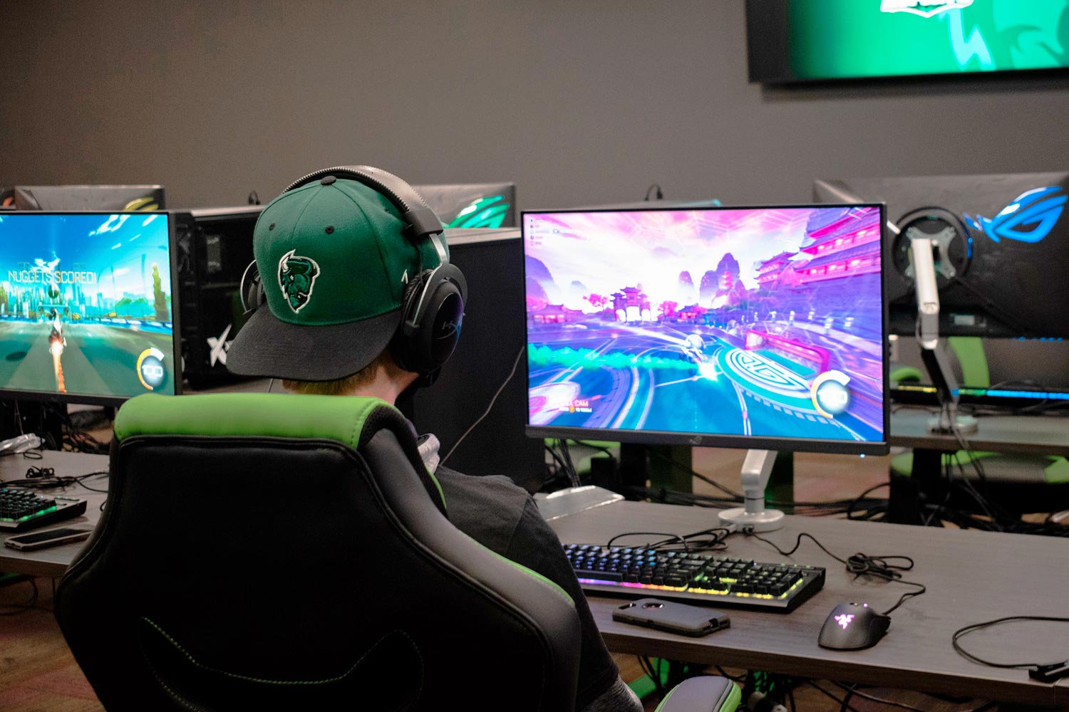 The esports training room includes 16 high-powered gaming stations with 27” HDR gaming monitors. Signals from any gaming station can be routed to the wall-mounted large screen displays and the SMP 111 streaming media processor.