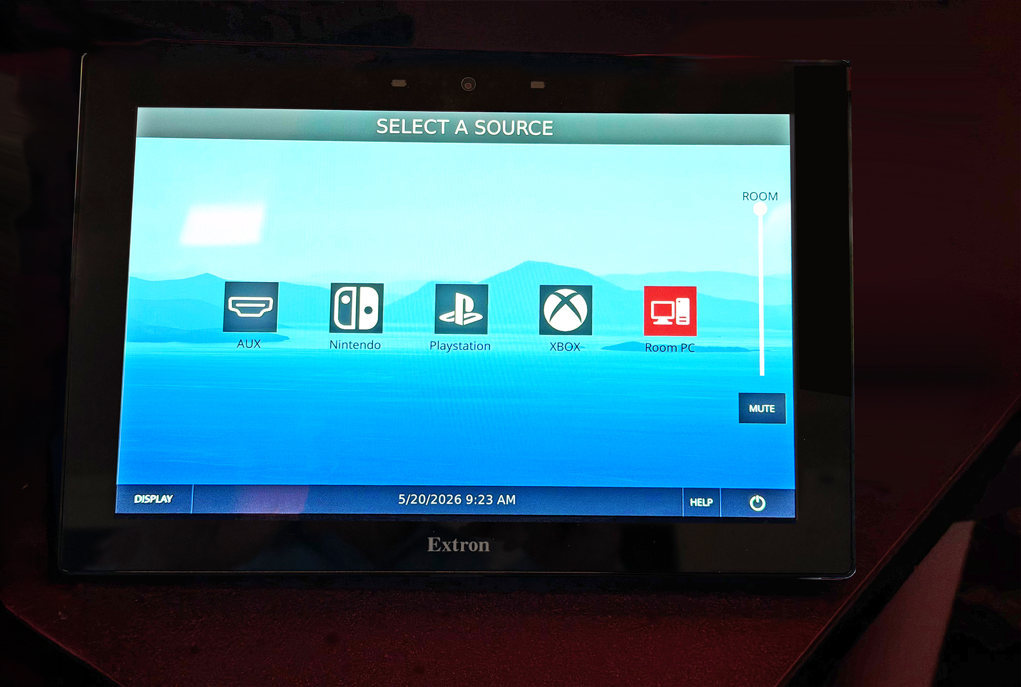 Extron touchpanel in “Select a Source” mode, enabling easy switching between gaming inputs like Xbox, PlayStation, Nintendo, and PC.