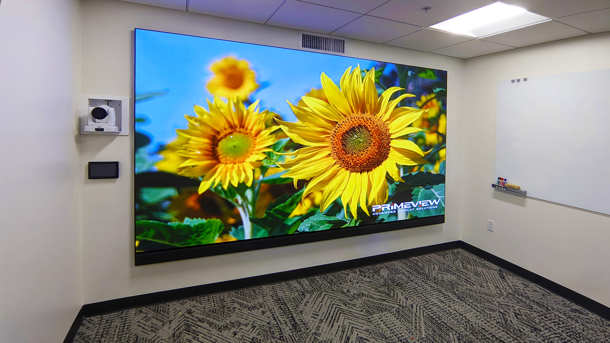 The videowall within the Sister Mary Kieran Memorial Library at Santa Catalina School enables students to experience collaboration on a professional scale.