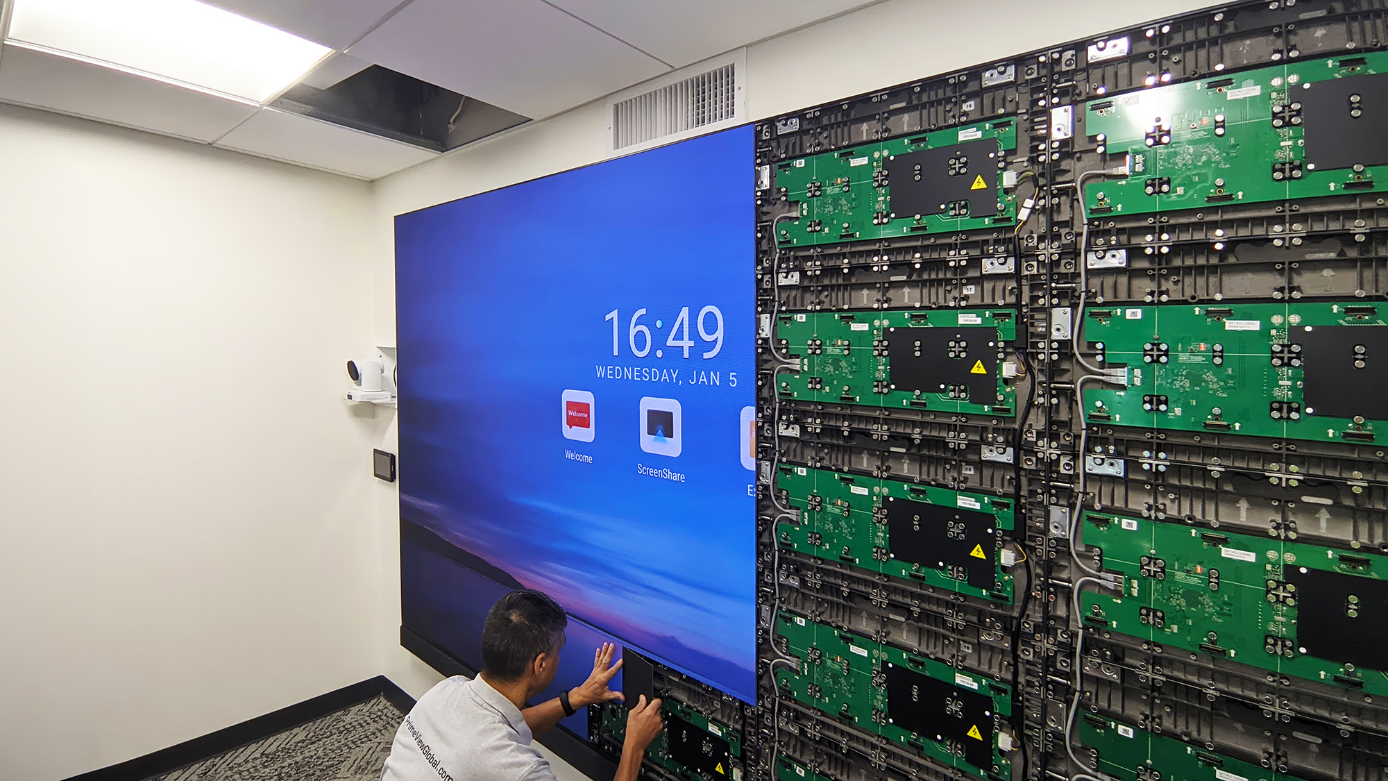 An EKC integration specialist works on site to deploy the videowall system. 