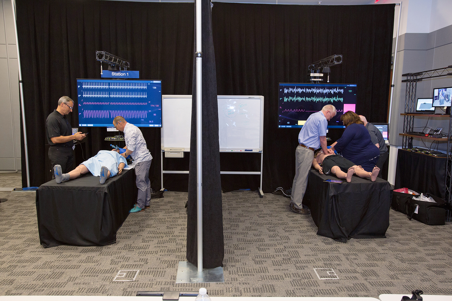 Proof of concept Simulator Station 1 is on the left and Station 2 is on the right. Sessions were shared with the overflow and debriefing rooms over the Extron NAV Pro AVoIP system.