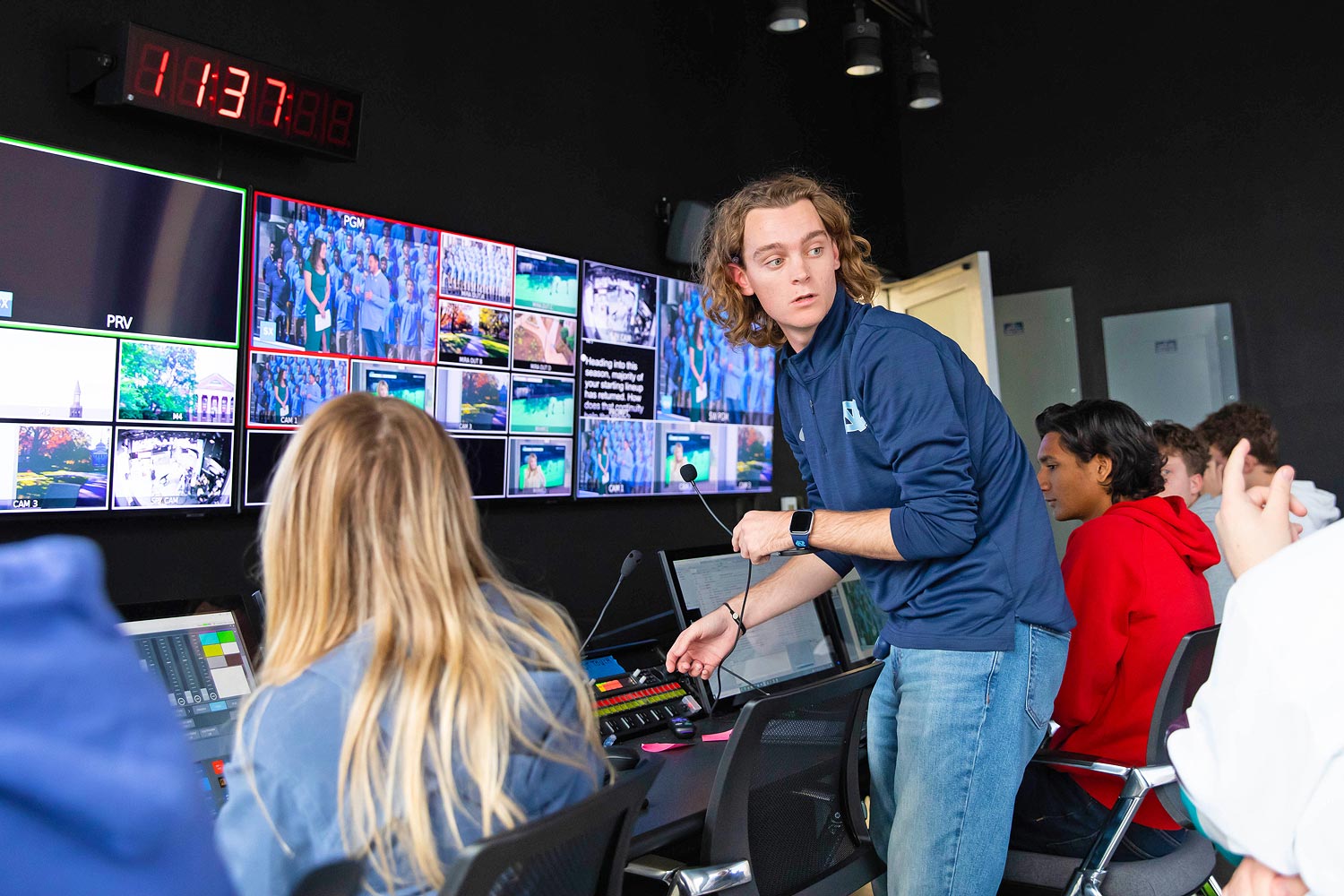 James F. Goodman broadcast studio control room, staffed by students, is a beehive of activity during a live broadcast.