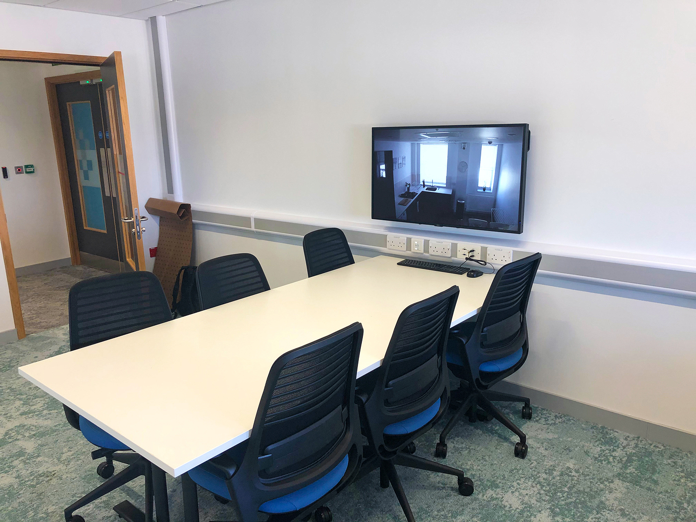 NAV Pro AVoIP encoders and decoders facilitate observation of interview room activities on the flexible classrooms' projection systems. The ProDSP audio processor and speakers facilitate two-way communication with each collaboration pod.