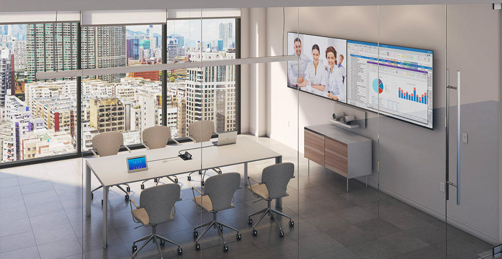 Conference room with dual screens for collaboration.