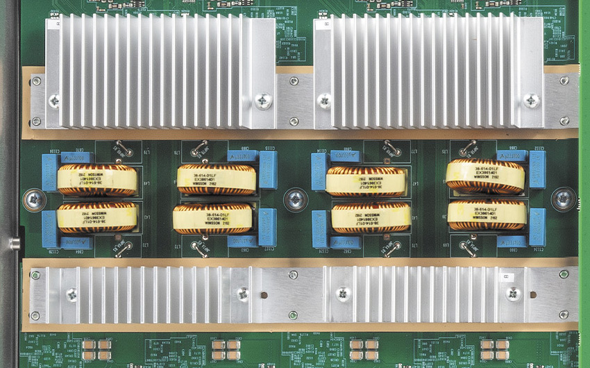 Interior of an Extron product showing large heat sinks and other components