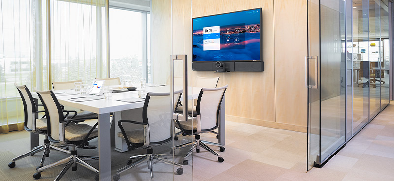 Meeting table with laptop and tablet connect to Cable Cubby ports